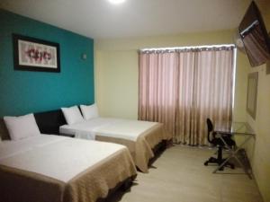 Cama o camas de una habitación en Hotel Vicente de la Vega