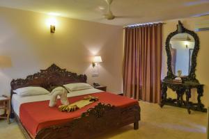Voodi või voodid majutusasutuse Tembo Palace Hotel toas