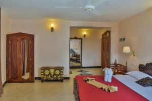 Voodi või voodid majutusasutuse Tembo Palace Hotel toas