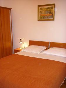 Postel nebo postele na pokoji v ubytování Apartments M&R ŠPADINA