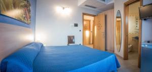 Postel nebo postele na pokoji v ubytování Hotel Mirage