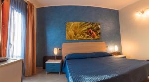 Postel nebo postele na pokoji v ubytování Hotel Mirage
