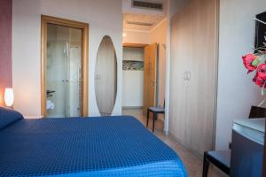 Postel nebo postele na pokoji v ubytování Hotel Mirage