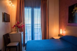 Postel nebo postele na pokoji v ubytování Hotel Mirage