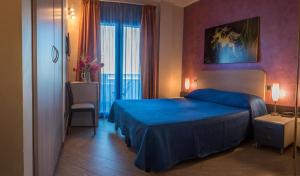 Postel nebo postele na pokoji v ubytování Hotel Mirage
