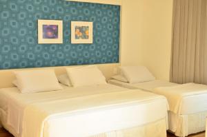 Postel nebo postele na pokoji v ubytování Unico Apart Hotel