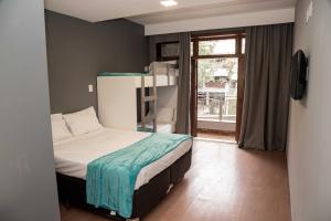 a small bedroom with a bed and a window at REF House Barra Da Tijuca in Rio de Janeiro +37 photos