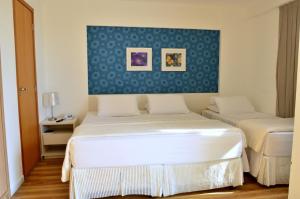 Postel nebo postele na pokoji v ubytování Unico Apart Hotel