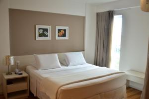 Postel nebo postele na pokoji v ubytování Unico Apart Hotel