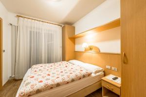 Posteľ alebo postele v izbe v ubytovaní Garni Tyrolia