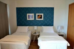 Postel nebo postele na pokoji v ubytování Unico Apart Hotel