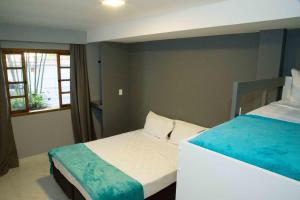 REF House Barra Da Tijuca客房内的一张或多张床位