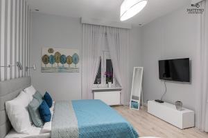 Televízia a/alebo spoločenská miestnosť v ubytovaní Mateyko Apartment
