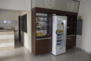 a refrigerator with its door open in a kitchen at Hotel Sul Real in Ji-Paraná