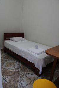 Una cama o camas en una habitación de Tengana Hospedaje y Tours