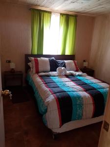 Postel nebo postele na pokoji v ubytování Cabañas Los Cipreses + 23 fotografií