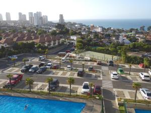 an aerial view of a parking lot with a pool at Laura Barros, Con Con in Concón