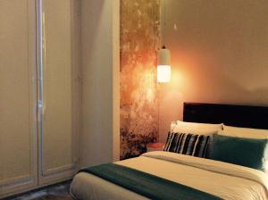 Posteľ alebo postele v izbe v ubytovaní B&B NAPOLI AMORE MIO