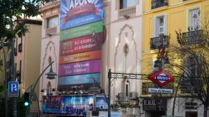 a group of signs on the side of a building at Far Home Plaza Mayor in Madrid