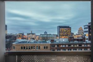 a view of a city skyline from a building at Hotel Faubourg Montreal Centre-Ville Downtown in Montréal