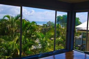 a view of the ocean from a room with windows at Apollo 1, 9 Hodgson Street in Crescent Head