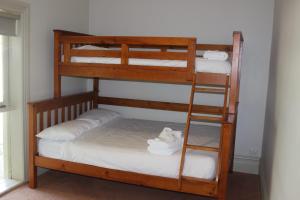 a couple of bunk beds in a room at 20 Mountbatten Ave, Bright in Bright