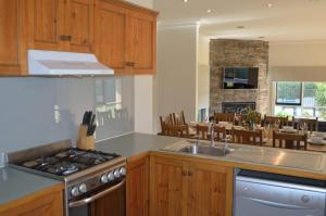 a kitchen with a sink and a stove top oven at 20 Mountbatten Ave, Bright in Bright