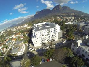 an aerial view of a building with a mountain in the background at Stylish Gem in Cape Town