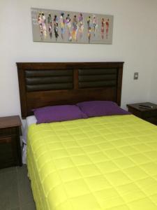 A bed or beds in a room at Dpto Laguna del Mar-WIA