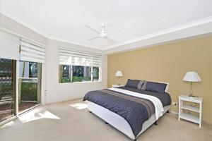 A bed or beds in a room at Westport Palms 14 Buller Street