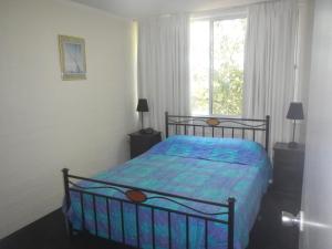 A bed or beds in a room at Portsea 16 14 Surf Street