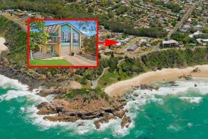 an aerial view of a house on a beach at Amara 6 Wesley Avenue in Port Macquarie +3 photos