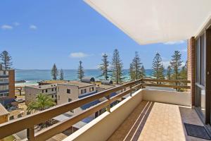 a balcony with a view of the ocean at Akuna 18 6 Joffre Street in Port Macquarie