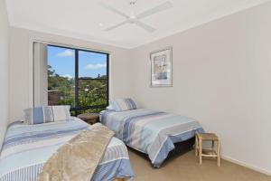 A bed or beds in a room at Amara 6 Wesley Avenue