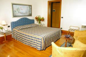 Posteľ alebo postele v izbe v ubytovaní Hotel Luna