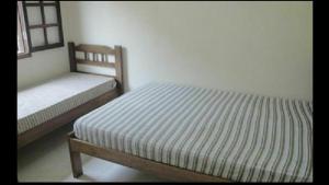 Ένα ή περισσότερα κρεβάτια σε δωμάτιο στο Casas em Boracéia