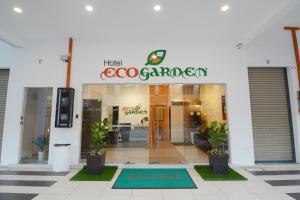 a store with a sign on the front of it at Eco Garden Hotel in Rawang