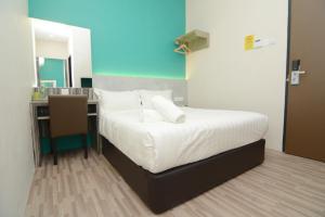 Postel nebo postele na pokoji v ubytování Eco Garden Hotel