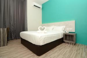 Postel nebo postele na pokoji v ubytování Eco Garden Hotel