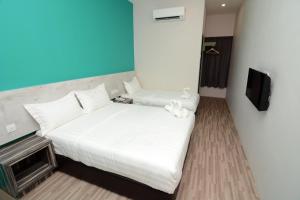Postel nebo postele na pokoji v ubytování Eco Garden Hotel