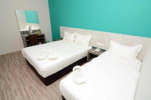 Postel nebo postele na pokoji v ubytování Eco Garden Hotel