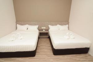 Postel nebo postele na pokoji v ubytování Eco Garden Hotel