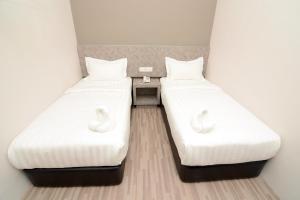 Postel nebo postele na pokoji v ubytování Eco Garden Hotel