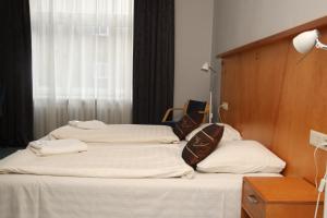 Postel nebo postele na pokoji v ubytování Guesthouse Jakob Lenz