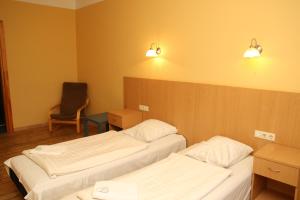 Postel nebo postele na pokoji v ubytování Guesthouse Jakob Lenz