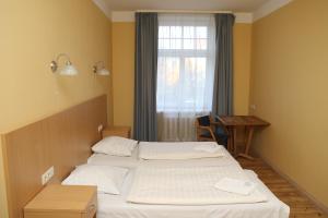 Postel nebo postele na pokoji v ubytování Guesthouse Jakob Lenz