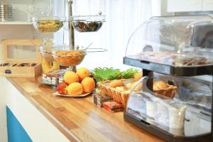 a counter with a bunch of food on it at City Hotel Storch in Cologne