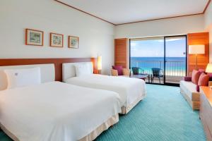 Postel nebo postele na pokoji v ubytování Hotel Nikko Guam