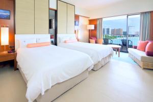 Postel nebo postele na pokoji v ubytování Hotel Nikko Guam