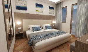 Postel nebo postele na pokoji v ubytování Paestum Inn Beach Resort